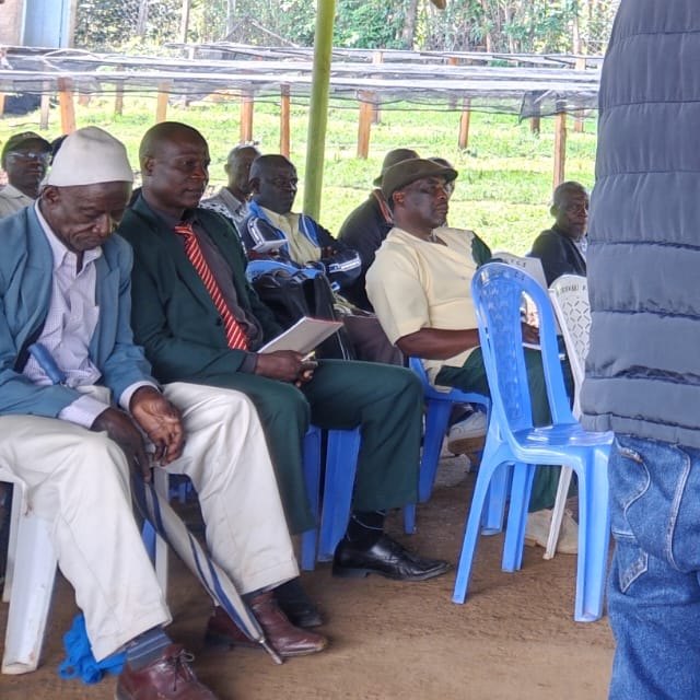Members of New Chesikaki Farmer Cooperative Society seated under a shelter during a Digilive training session